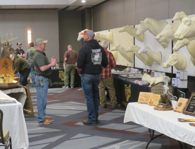 Men standing in the supply area talking